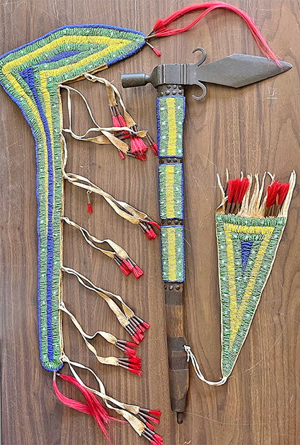 Native American tomahawk pipe with beaded bag, 24