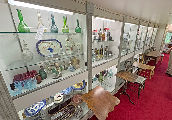 There are many cases filled with ceramics, glass, redware, firearms, and more.