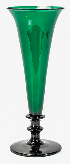 The circa 1840 blown glass trumpet vase is probably from one of the Pittsburgh factories. The deep emerald- green piece rests on a darker green, nearly black, 4½