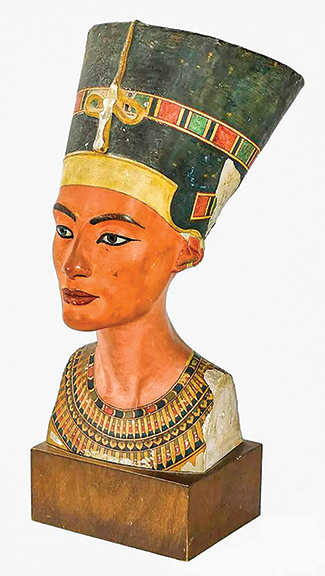 The high lot of the sale was this replica plaster bust of Egyptian Queen Nefertiti (New Kingdom, 18th Dynasty, 1550-1292 B.C.E.). The original bust was created circa 1340 B.C.E.  and is now one of the most popular attractions at the Neues Museum, Berlin, Germany, in the museum’s Nefertiti collection. This casting dates from the first half of the 20th century and replicates the original bust, complete with areas of repaired damage. It differs from the original only in that the queen’s proper left eye has been repaired and repainted and a small seal has been added to the back. The German language seal translates to “Gypsum Molding / State Museums in Berlin.” The bust sold for $2144 (est. $500/700).
