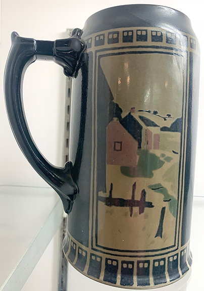 This clay tankard by the Ceramic Art Company, which became Lenox, features a design based on a print by Arthur Wesley Dow. It was part of an 1897 china painting exhibition, Tommy McPherson said. He wanted $4750 for it.