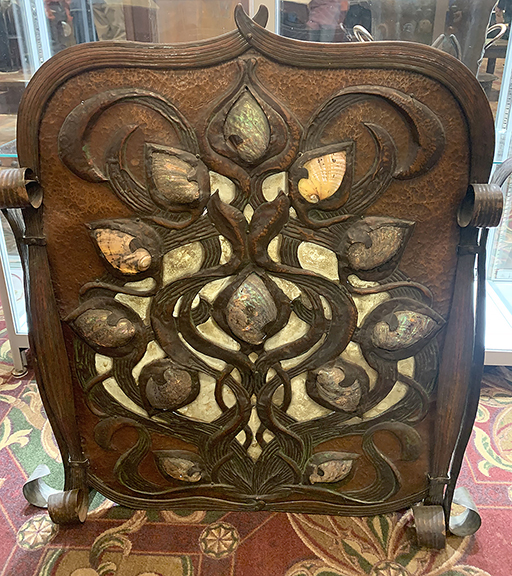 This copper and iron fire screen by Elizabeth Eaton Burton was offered by Robert Kaplan for $165,000. Though it is unsigned, a photo from the Santa Barbara, California, studio of the artist, known for her metalwork and other media with floral motifs, shows the screen, which was never cataloged. The piece from 1903-04 is decorated with abalone shells.