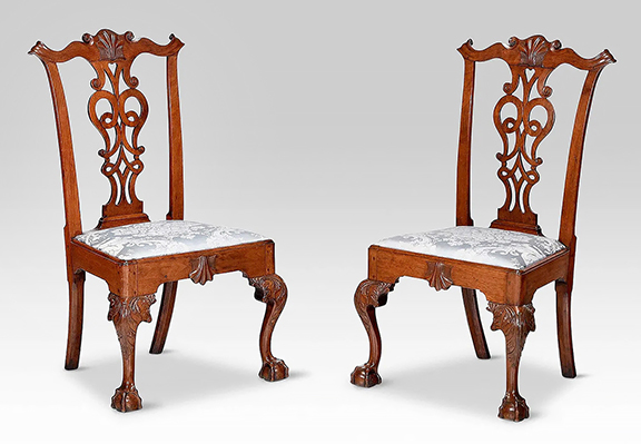 Photos of this pair of Pennsylvania Chippendale walnut side chairs were published in Albert Sack&rsquo;s 1950 book, Fine Points of Furniture: Early American and in American Antiques from Israel Sack Collection, vol. III. Andrew Brunk referred to the interwoven strapwork and heart pierced splat as &ldquo;an unusual design.&rdquo; The 41