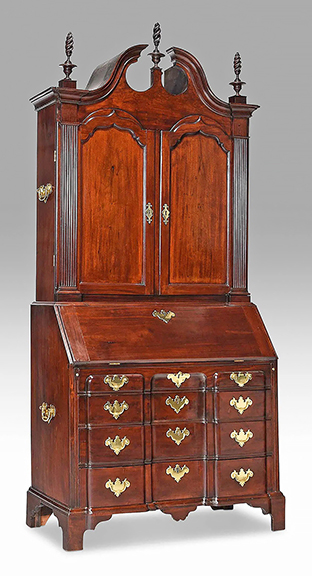 The Boston Chippendale block front mahogany desk and bookcase attributed to Benjamin Frothingham (1734-1809) of Charlestown, Massachusetts, has sturdy handles on the upper and lower cases. The 1760-70 desk/bookcase once sat in the living room of collector and preservationist Ralph Carpenter Jr. (1909-2009). Photos appear in volume VII of American Antiques from the Israel Sack Collection. The 96&frac14;