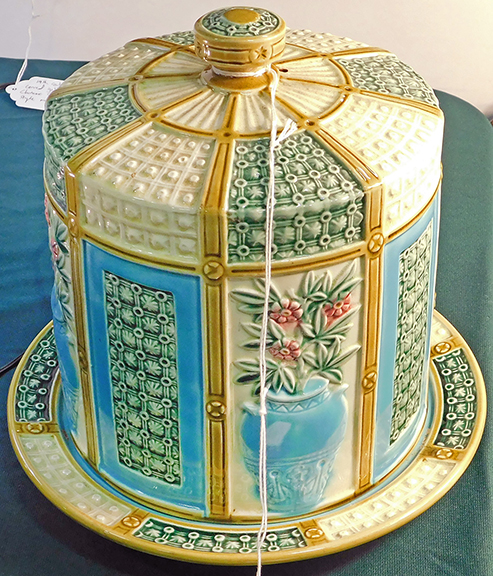 Peter Murphy of P.D. Murphy Antiques, Bath, Maine, offered a 19th-century Wedgwood cheese dome in high relief with a matching underplate, marked with a date code indicating 1864, for $550.