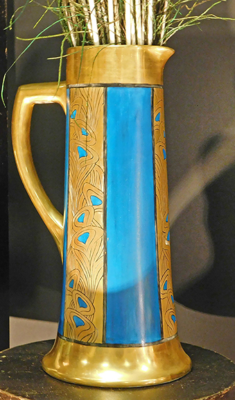 Here&rsquo;s a tall 1920s or 1930s Arts and Crafts &ldquo;peacock feather&rdquo; pitcher from David Weidner of Dark Flowers Antiques, Haverhill, Massachusetts. Priced at $395, it was probably made in France, then shipped here for decoration, Weidner explained, adding that the design came from Keramic Studio magazine of Syracuse, New York.