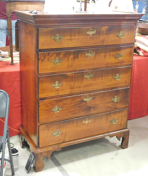 Among Martin Ferrick&rsquo;s assortment of elegant furniture was this New England Chippendale chest with five graduated drawers in figural maple, standing on a short, scroll-cut base. The Lincolnville, Maine, dealer and furniture restorer was looking for $1950 for it. 