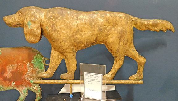 The tag on this 19th-century copper weathervane with a robust gold leaf surface proclaims, &ldquo;This Dog Can Hunt.&rdquo; Nancy Douglass of Willow Springs Perennial Antiques, Rexford, New York, was hunting $3200 for it. As I was leaving the booth, my eyes fell upon this elaborately carved bed warmer, earlier and fancier than any I&rsquo;d ever seen. &ldquo;I don&rsquo;t think it was used in a while,&rdquo; Nancy smiled. She wasn&rsquo;t sure if it is American or European, but $950 looked like a fair price.