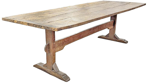 Having a four-board top and shoe feet, this trestle table with original surface sold for $2700 (est. $1000/3000). It measures 31&frac34;
