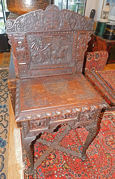 This elaborate dressing table features a full coverage carved backsplash with a chariot drawn by two winged Pegasuses, flanked by two male figures, bearing a carved inscription &ldquo;LADIE FRANCES GOWER,&rdquo; and a date of &ldquo;1645,&rdquo; but overall construction suggests it&rsquo;s a late 19th-century Jacobean Revival interpretation of a famous table from the English Civil War period of the mid-17th century. The $1200/1800 estimate and the $720 selling price appear to confirm that. Sisco photo.