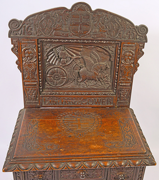 This elaborate dressing table features a full coverage carved backsplash with a chariot drawn by two winged Pegasuses, flanked by two male figures, bearing a carved inscription &ldquo;LADIE FRANCES GOWER,&rdquo; and a date of &ldquo;1645,&rdquo; but overall construction suggests it&rsquo;s a late 19th-century Jacobean Revival interpretation of a famous table from the English Civil War period of the mid-17th century. The $1200/1800 estimate and the $720 selling price appear to confirm that. Sisco photo.
