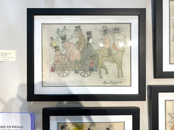 A selection of ledger drawings by Sammus Gray Owl of Crow Creek Indian Reservation, South Dakota, were offered by Carlson & Stevenson Antiques, Manchester Center, Vermont. In one drawing, an Indigenous person wearing a top hat and smoking a pipe is driving a wagon full of assorted critters that is pulled by a deer with a beaver on its back, all of whom are also smoking pipes and wearing top hats, including the bird perched on a boar&rsquo;s hat. The drawing was priced at $2500. Gray Owl created 51 meticulously drawn and colored drawings between 1918 and 1925. Carlson & Stevenson Antiques also showed a selection of drawings by Barbara Shermund (1899-1978) for The New Yorker and Esquire. In a change of pace, the paint-decorated candlestand, circa 1790, with the original polychrome egg-and-dart border, possibly central Massachusetts was tagged $2650. The top was cleaned professionally 27 years ago. Also displayed was a Shaker No. 1 rocking chair with shawl rack and an aqua painted finish over an earlier old brown surface, priced at $3800.