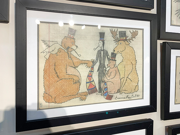 A selection of ledger drawings by Sammus Gray Owl of Crow Creek Indian Reservation, South Dakota, were offered by Carlson & Stevenson Antiques, Manchester Center, Vermont. In one drawing, an Indigenous person wearing a top hat and smoking a pipe is driving a wagon full of assorted critters that is pulled by a deer with a beaver on its back, all of whom are also smoking pipes and wearing top hats, including the bird perched on a boar&rsquo;s hat. The drawing was priced at $2500. Gray Owl created 51 meticulously drawn and colored drawings between 1918 and 1925. Carlson & Stevenson Antiques also showed a selection of drawings by Barbara Shermund (1899-1978) for The New Yorker and Esquire. In a change of pace, the paint-decorated candlestand, circa 1790, with the original polychrome egg-and-dart border, possibly central Massachusetts was tagged $2650. The top was cleaned professionally 27 years ago. Also displayed was a Shaker No. 1 rocking chair with shawl rack and an aqua painted finish over an earlier old brown surface, priced at $3800.
