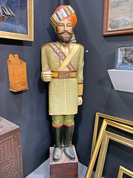 Perkins & Menson Antiques, Ashby, Massachusetts, stood this cigar store figure in a corner of the booth, and priced it at $3600. Not much later the figure was observed leaving the building in the arms of an exuberant collector.