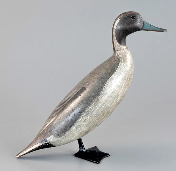 This standing pintail drake, circa 1910, by Charles S. Schoenheider Sr. (1854-1924) of Peoria, Illinois, is known as a standing “ice” decoy, used for late season shooting on the ice and a highly sought-after subset. Schoenheider made only a few dozen standing decoys, and they are considered the very best. This example, 18
