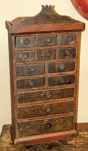Grain-painted spice cabinet made from shipping crates, late 19th century, spool pulls, 25½