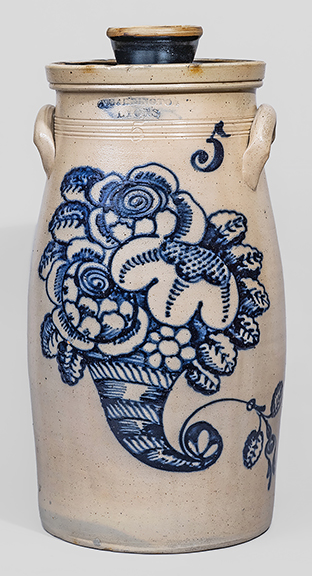 In very nice condition with an impressive cornucopia design, the five-gallon stoneware churn stamped “T. HARRINGTON / LYONS,” New York state origin, circa 1860, sold for $42,000 (est. $30,000/50,000). As outlined by Zipp in the catalog, “The extraordinary color of the 18½
