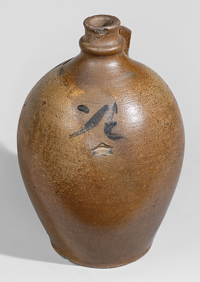 This extremely rare half-gallon cobalt-decorated stoneware jug/pottle, 10¼