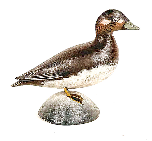 Early and rare, this slightly oversize white-winged scoter hen by A. Elmer Crowell, in original paint and condition, is signed faintly on the bottom with Crowell’s early round ink stamp and handwritten “Scoter F.” Estimated at $3000/6000, it sold for $3382.50.