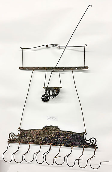 The country store sack holder, marked &ldquo;Use Handy Box French Show Blacking,&rdquo; was $895 from Mr. and Mrs. Smith Antiques, Harlan, Iowa.