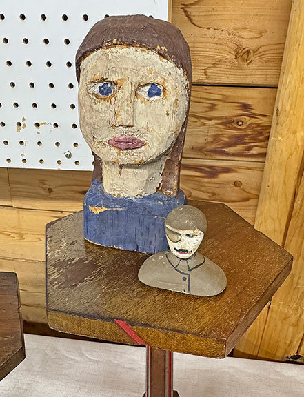 The large carved head came from the Vermont area, dating to the 1950s-60s, and was $135 from Thais Glazman of Child of Folk, New York City. The World War I-era carving&mdash;he was missing one half of his goggles&mdash;was $65.