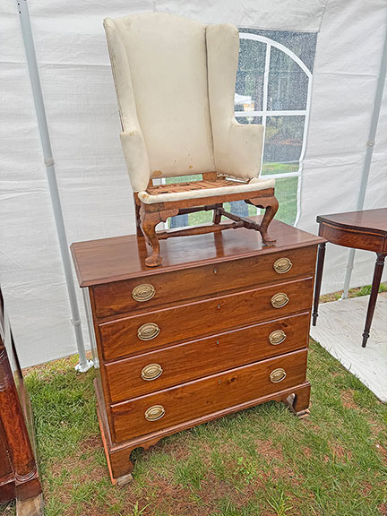 Jon Rider of J.E. Rider Antiques, Essex, Massachusetts, was outside, safely walled in a tent. He asked $2400 for the circa 1790 Connecticut cherry chest, and $1400 for the miniature wing chair.