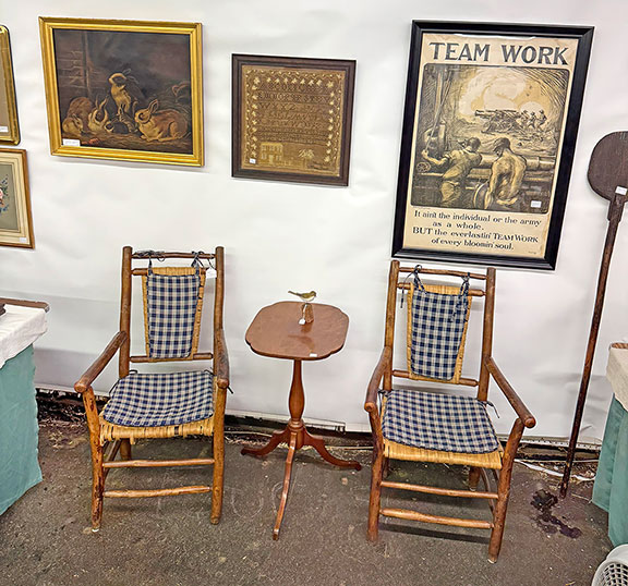 Michael and Lucinda Seward of Pittsford, Vermont, offered a pair of Adirondack armchairs for $225; a bird carving by Sandwich, Massachusetts, woodcarver Philip &ldquo;Peter&rdquo; Peltz (1915-2001) was $345; the early 19th-century cherry stand was $375, the 19th-century oil on canvas of bunnies, circa 1870, was $975; the 1830 needlework by Maria Bacon was $950; and the rare World War I &ldquo;Team Work&rdquo; poster by Burleigh Litho. Co., Troy, New York, was $950.