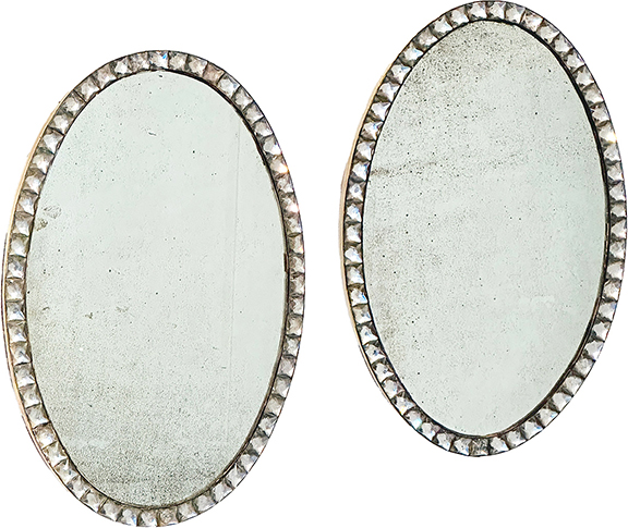 The George III mirrors made in Ireland, circa 1790, are set in oval frames with large square cut-glass beads. Each measures 23¼