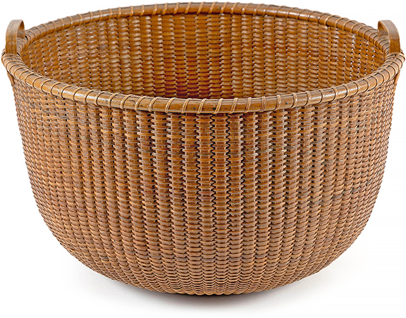This rare bushel-size late 19th-century Nantucket Lightship basket is attributed to Captain Davis Hall, and measures 11&frac12;