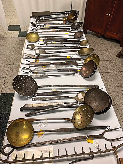 Dealer Greg Kramer of Greg K. Kramer & Co., Robesonia, Pennsylvania, gives choices. Here is a very large selection of early utensils and cookie cutters.