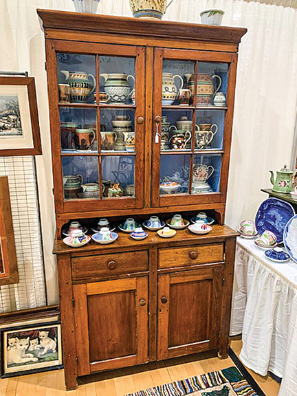 David Kurau of Lampeter, Pennsylvania, sold a variety of ceramics. Here is one of the Pennsylvania Dutch cupboards he brought to the show, marked $1100.