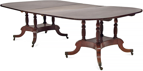 By tradition this late Federal two-part carved mahogany dining table is attributed to Duncan Phyfe (1768-1854) of New York City. With one leaf and brass clips and 29