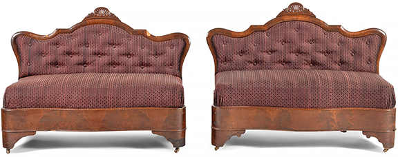 This pair of Classical veneered mahogany and upholstered settees, 1840-50, each 32