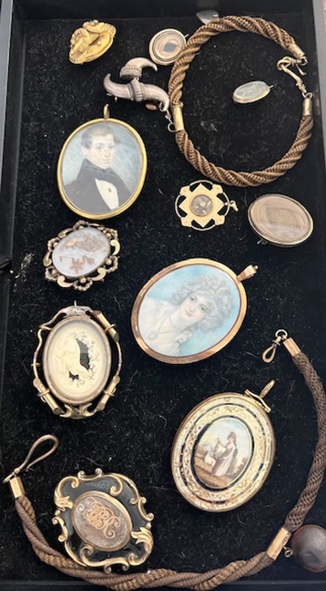 Important collection of antique mourning jewelry, (4) trays, over 120 pieces.