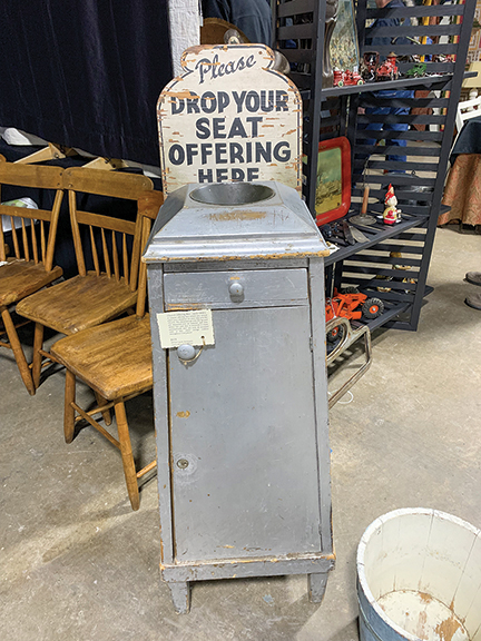 “Please Drop Your Seat Offering Here” reads the sign on this church offering box, circa 1900, that was priced at only $375 by Wilori Lane Antiques, Rochester, New York.