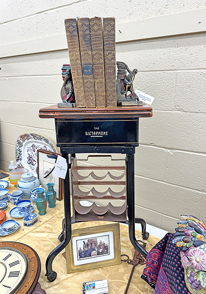 The restored 1930s Dictaphone table was $165 from Denise Monroe of New Boston, New Hampshire. The four volumes of National Portrait Gallery of Distinguished Americans, 1865, was $145, and the pair of “Struggling Librarian” bookends by Kronheim & Oldenbusch Co. was tagged $125.