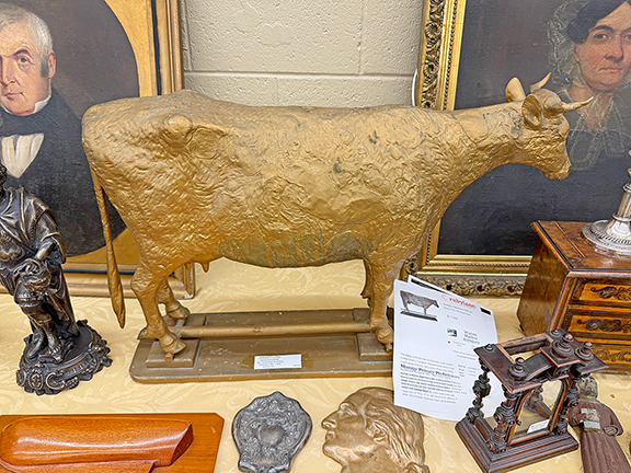 The Jersey cow weathervane by L. W. Cushing & Sons, Waltham, Massachusetts, circa 1880, was tagged $5500 from Robert Deluca Antiques, Ipswich, Massachusetts.