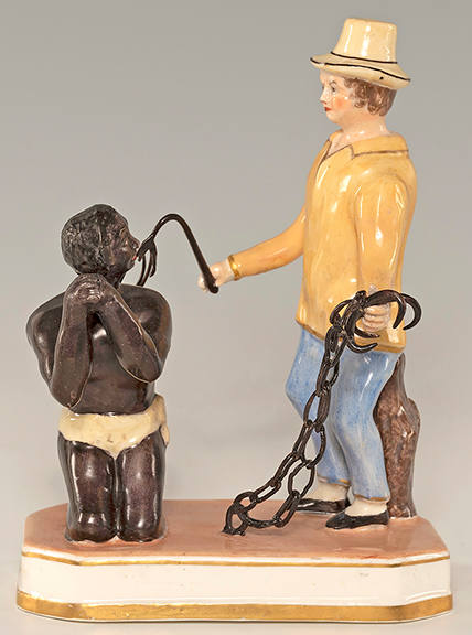 Circa 1820 Staffordshire figure of an enslaved man being whipped, 6&frac14;