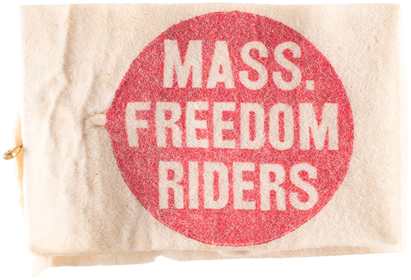 This 1961 felt armband, bound with a safety pin closure, reads &ldquo;Mass. Freedom Riders&rdquo; in a red circle. It is an artifact of the Congress of Racial Equality (CORE), which sponsored freedom rides that sought to integrate mass transit in the segregated South. It is 5&frac12;