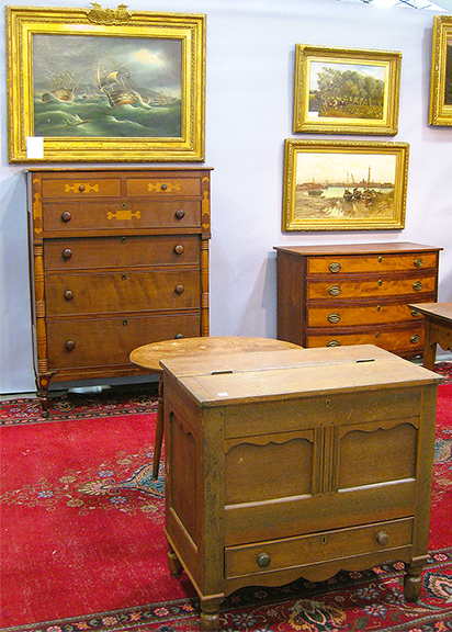 Larry N. Thompson of Mr. Chippendale’s Best, Snellville, Georgia, is certainly a furniture man, but he brought great paintings as well. The 1844 painting at top left shows ships engaged in the Battle of Trafalgar. By British marine painter Richard Ball Spencer (1812-1897), it was $6500. The outstanding frame has more sails at the top and plaques with the combatants’ names: Princess Charlotte, Bellerophon, and Benbow. The inlaid cherry chest below, from the Piedmont region of North Carolina, dated 1820, was $3000.