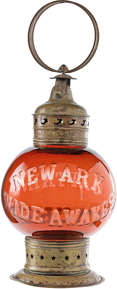 An 1860 Newark Wide Awakes presentation glass lantern sold for $100,000 (starting bid: $30,000). The brass and ruby glass globe lantern, 17