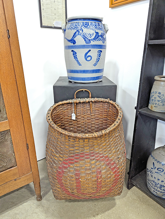 Found in the booth of Swala’s Antiques, Washington, Pennsylvania, this pack basket with an “O” and a “U” painted in red on the front was tagged $550, while the six-gallon stoneware beauty, probably from Greensboro, Greene County, Pennsylvania, could be had for $3600. 