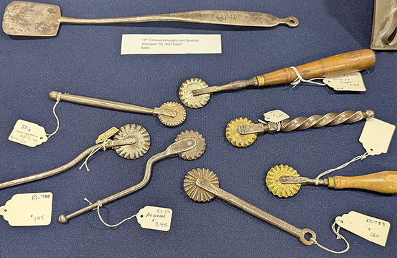Making a pie? Need to crimp your crust? Karl Pass had this assortment of beauties, any of which would do an admirable job. The crimpers were priced from $295 for the crimper with the twisted handle to $85 for a simpler straight-handled example. The 19th-century wrought-iron spatula displayed above the crimpers is stamped “J.L. Mettler” and had a $295 price tag.