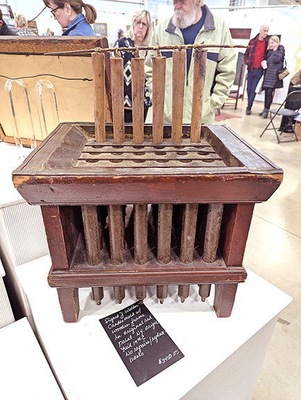 Bradford Craig White American Antiques, Wilkes-Barre, Pennsylvania, offered this outstanding New York candle mold with a wooden frame in original red paint for $3450. It is signed “J. Walker” and has no repairs or replacements.