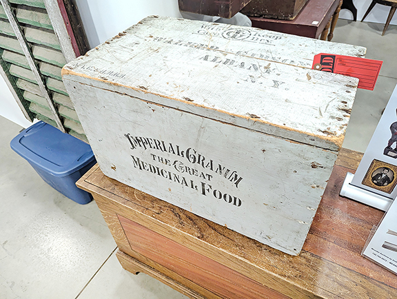 Sold by Meander Auctions, Whipple, Ohio, was this blue-painted box stenciled on the front “Imperial Granum / The Great / Medicinal Food.” The top is stenciled “Walker Gibson / Albany, N.Y.,” and one side is marked “Imperial / Granum / The Great / Medicinal / Food / Six Dozen / Small-Tins.”