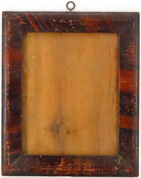 This picture frame constructed of yellow pine displays a black and red folk-art paint-decorated surface. The bubbled glass is handmade, and the back is a single board. The 13
