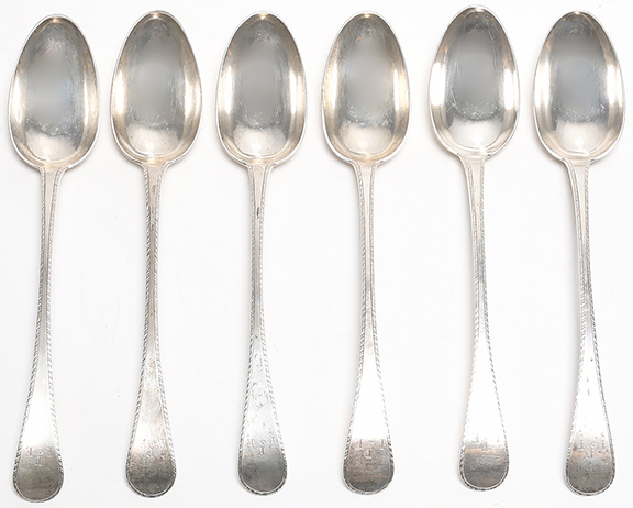 Six feather-edge spoons, with dove and olive branch decorations to the backs of the bowls, monogrammed at the terminals, all stamped three times at the stem “EM” for Edmund Milne (1742-1822), Philadelphia, circa 1800, each 9½