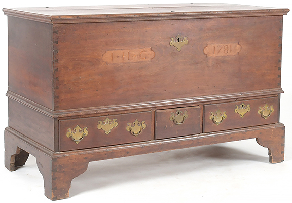 Chester or Lancaster County, Pennsylvania, Chippendale inlaid walnut blanket chest, tulip poplar and pine secondary woods, inscribed “I•H•G” and “1781,” with original hardware, strap hinges, a rectangular top with applied molded edges, and waist molding over three drawers, all raised on tall dovetailed bracket feet, with an inner covered till with two small concealed drawers beneath, sold for $1800 (est. $1500/2000) to dealer James Grievo of Stockton, New Jersey, in the salesroom.