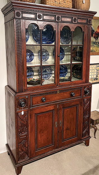 This Bergen County, New Jersey, cupboard, 1815-25, has wild carving and was $6500 from Daniel and Karen Olson of Newburgh, New York. It sold.