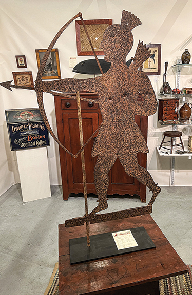 Sheet-iron weathervane of a Native American with a drawn bow, 19th century, with old repairs, $8800 from Robert M. Conrad Antiques, Yeagertown, Pennsylvania.
